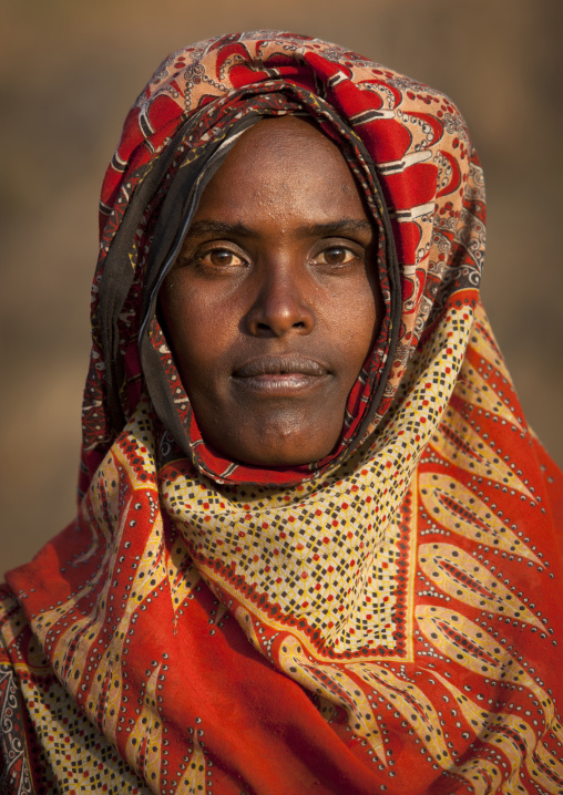 Portrait Of A Smiling Young Oromo Woman With Orange Scarf, Dire Dawa, Ethiopia