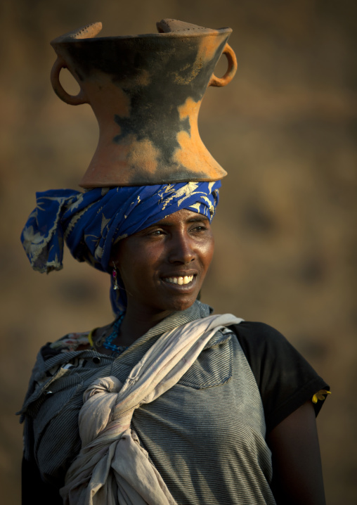 Portrait Of An Oromo Woman Going Back From The Market With A Cofee Pot On Her Head, Dire Daw, Ehiopia