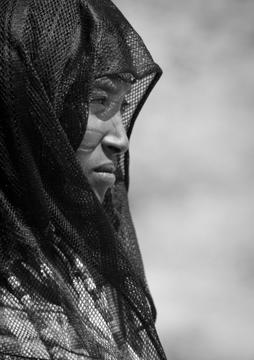 Black And White Profile Portrait Of A Karrayyu Tribe Woman With Facial Scarifications And Black Headscarf, Metahara, Ethiopia
