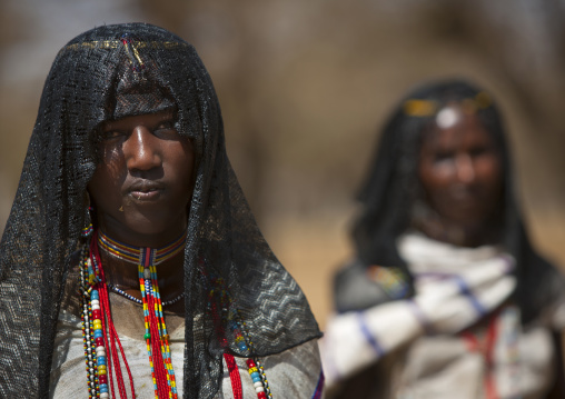 Two Karrayyu Tribe Women With Black Headscarf And Colourful Jewels, Metahara, Ethiopia