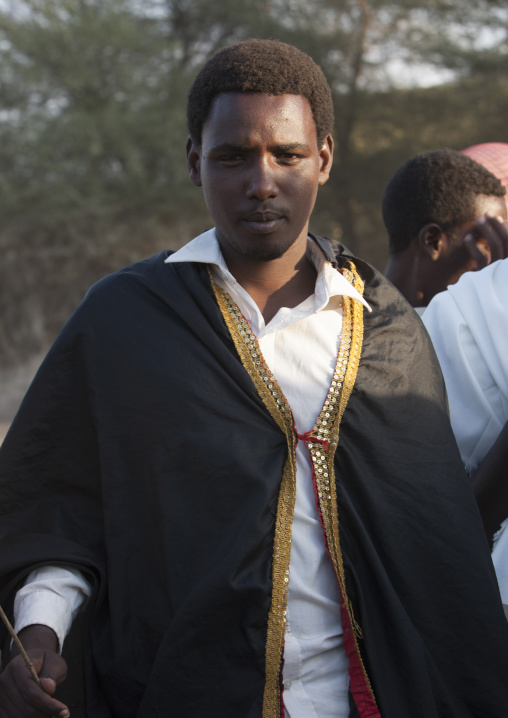 Portrait Of A Young And Smiling Karrayyu Tribe Man In Traditional Clothes During Gadaaa Ceremony, Metahara, Ethiopia