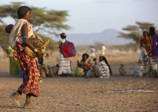 Karrayyu Tribe Woman Arriving At Dawn With Her Baby For The Gadaaa Ceremony, Metahara, Ethiopia
