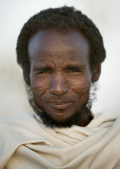 Portrait Of A Smiling Karrayyu Tribe Man With Scarifications On His Cheeks, Metahara, Ethiopia