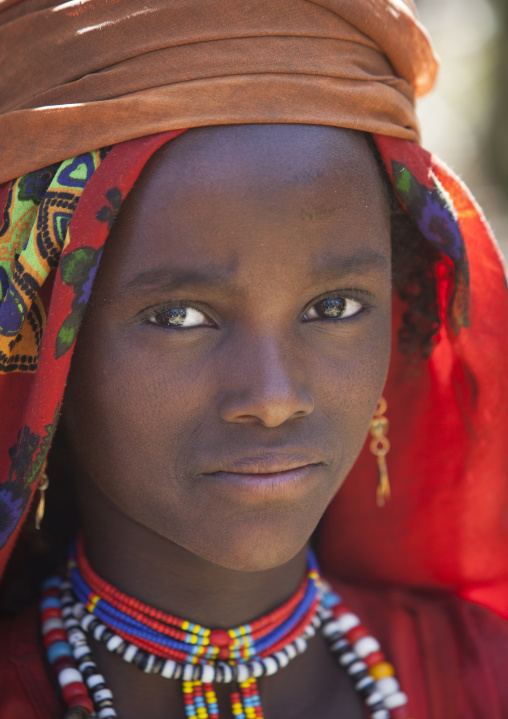 Portrait Of A Karrayyu Tribe Girl With Colourful Jewels And Head Scarf At Gadaaa Ceremony, Metehara, Ethiopia