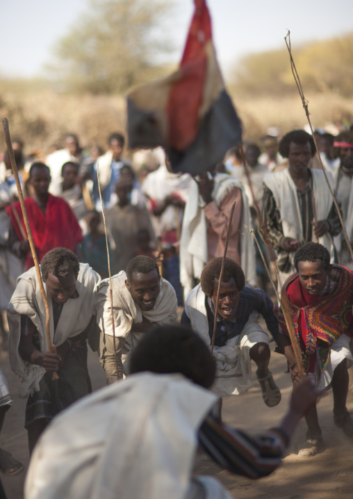 Group Of Karrayyu Tribe Men During Choreographed Stick Fighting Dance, Gadaaa Ceremony, Metahara, Ethiopia