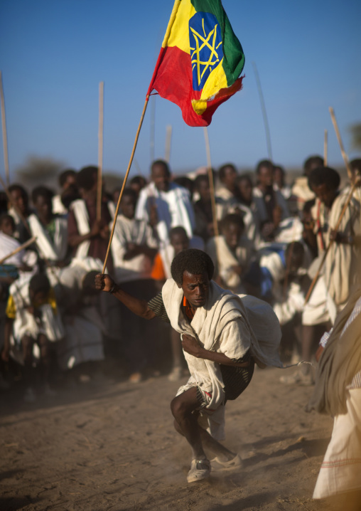 Karrayyu Tribe Man Carrying The Ethiopian Flag During Stick Fighting Dance, Gadaaa Ceremony, Metahara, Ethiopia