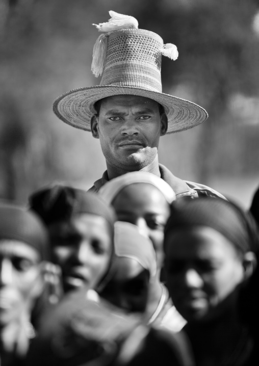 Very tall muslim man wearing big hat and standing over the crowd, Alaba, Ethiopia