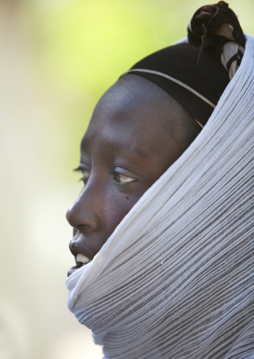 Profile portrait of an Ethiopian woman going to church, Zway, Ethiopia