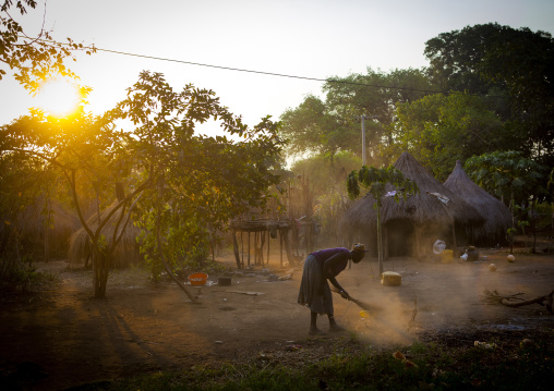 Anuak Tribe Woman Cleaning The Ground In Abobo, The Former Anuak King Village, Gambela Region, Ethiopia