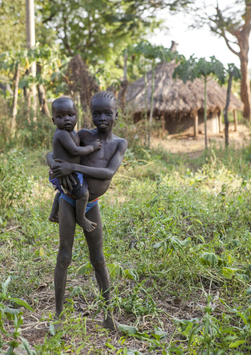 Anuak Child Holding A Baby In Abobo, The Former Anuak King Village, Gambela Region, Ethiopia