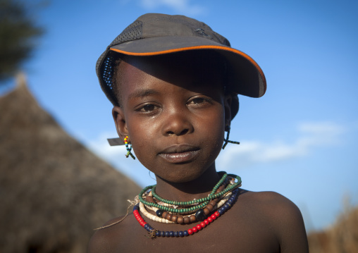 Litte Hamer Girl Tribe With A Western Cap, Turmi, Omo Valley, Ethiopia