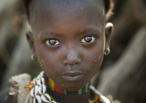 Litte Hamer Girl Tribe With Head Half Shaved  In Traditional Outfit, Turmi, Omo Valley, Ethiopia