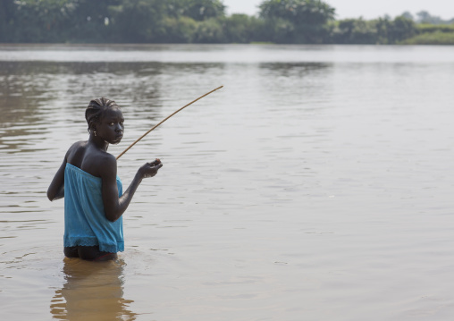 Anuak Tribe Girl Fishing On Baro River, Gambela, Ethiopia