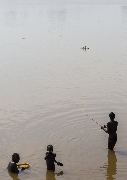 Anuak Tribe People Fishing On Baro River, Gambela, Ethiopia