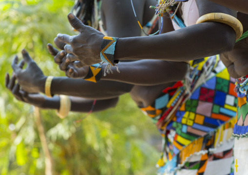 Women From Anuak Tribe In Traditional Clothing Dancing, Gambela, Ethiopia