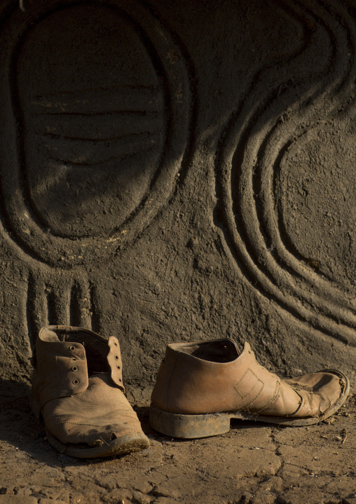 Old Shoes In Front Of An Anuak Traditional Hut In Abobo, The Former Anuak King Village, Gambela Region, Ethiopia