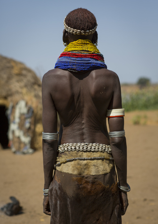 Portrait Of A Nyangatom Tribe Woman With Traditional Skirt, Omo Valley, Kangate, Ethiopia