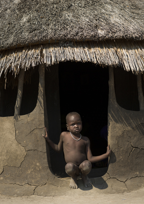 Nuer Tribe Little Boy At The Entrance Of His Hut, Gambela, Ethiopia