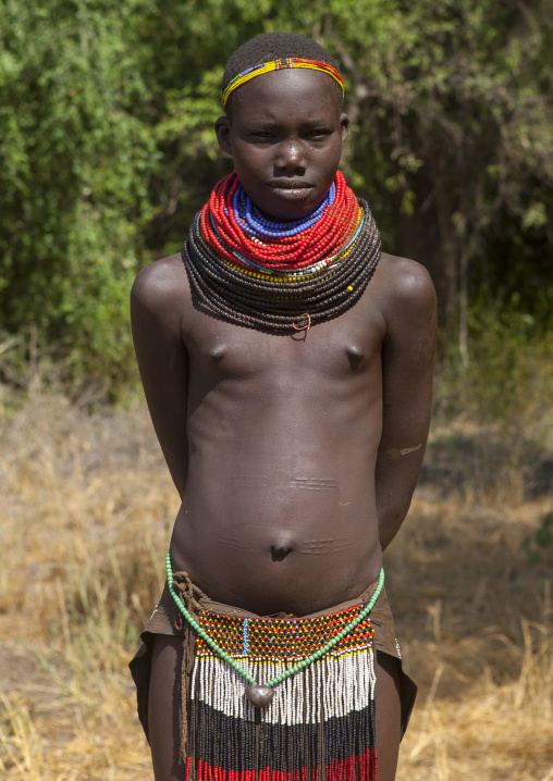 Portrait Of A Nyangatom Tribe Girl With Huge And Colourful Necklaces, Omo Valley, Kangate, Ethiopia
