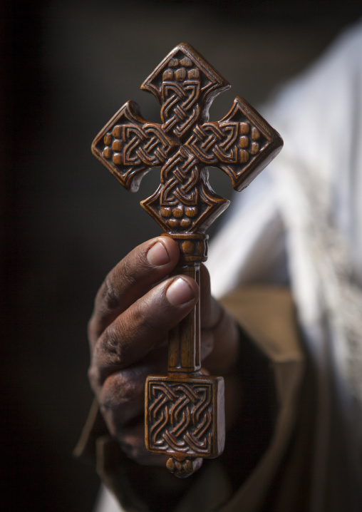 Priest Holding A Cross Inside Yemrehana Krestos Rock Church, Lalibela, Ethiopia