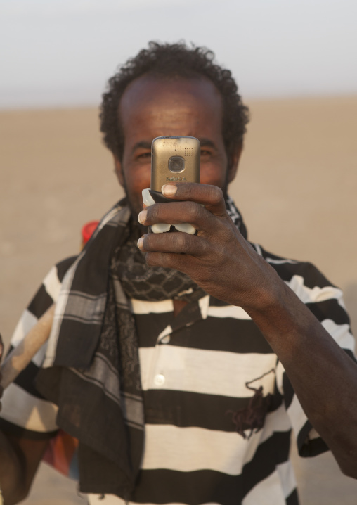 Afar Tribe Man Taking A Picture With His Mobile Phone, Assayta, Ethiopia