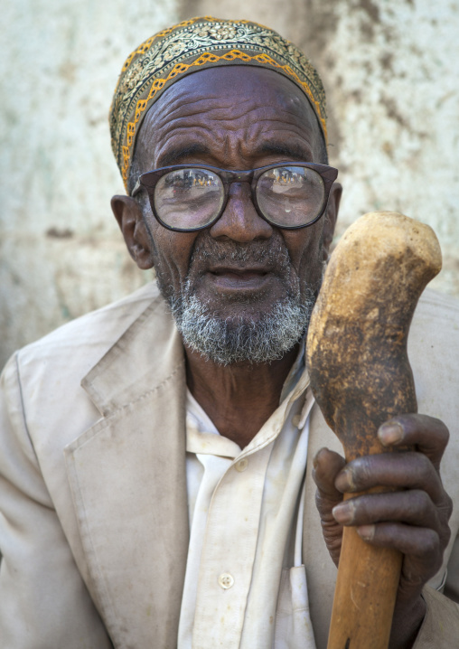 Old Man Without Teeth Crashing Some Qat In The Street, Harar, Ethiopia