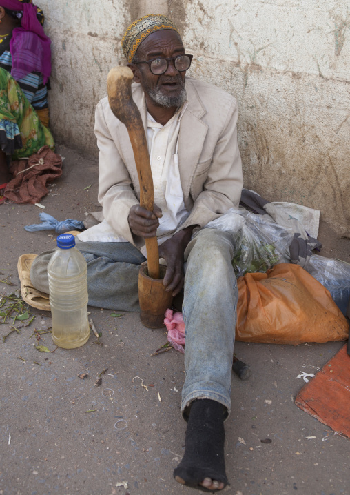 Old Man Without Teeth Crashing Some Qat In The Street, Harar, Ethiopia