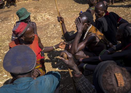 Men Negociating During A Mourning Ceremony To Know How Many Cows Will Be Killed In Hamer Tribe, Turmi, Omo Valley, Ethiopia
