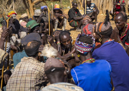 Men Negociating During A Mourning Ceremony To Know How Many Cows Will Be Killed In Hamer Tribe, Turmi, Omo Valley, Ethiopia