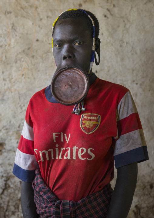 Mursi Tribe Woman With A Lip Plate And  An Arsenal Tshirt, Hail Wuha Village, Ethiopia