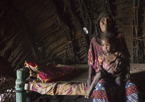 Afar Tribe Mother And Her Daughter Inside Her House, Afambo, Ethiopia