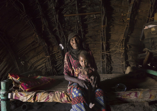 Afar Tribe Mother And Her Daughter Inside Her House, Afambo, Ethiopia