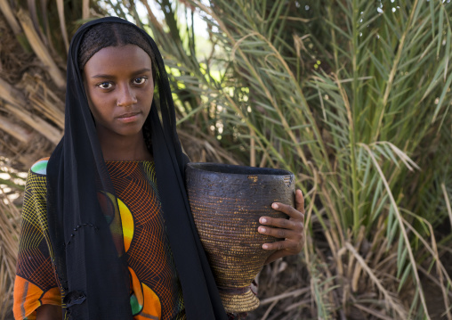 Fatouma Mahammed From Afar Tribe Holding A Pot Of Camel Milk, Afambo, Ethiopia