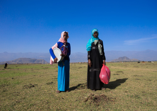 Oromo women in the plain going to market, Amhara region, Artuma, Ethiopia