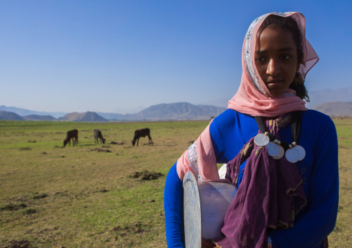 Portrait of an oromo girl with maria theresa thalers necklace, Amhara region, Artuma, Ethiopia