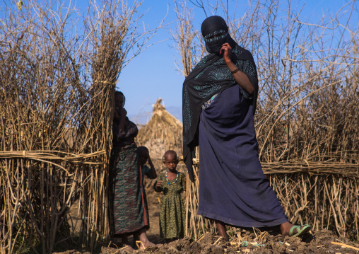 Oromo family in front of their hut, Amhara region, Artuma, Ethiopia