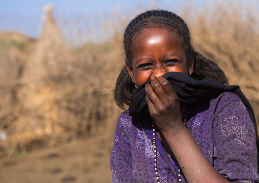 Portrait of an oromo woman laughing, Amhara region, Artuma, Ethiopia