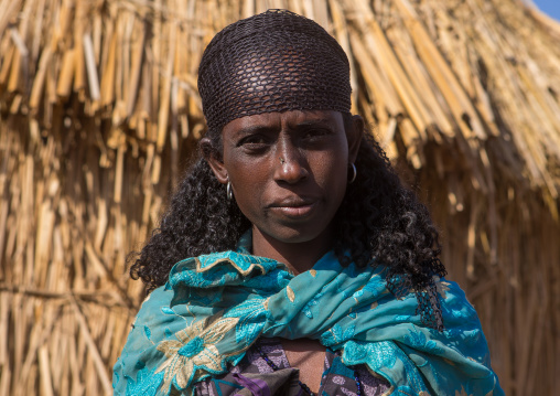 Portrait of an oromo woman with curly hair, Amhara region, Artuma, Ethiopia