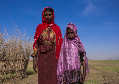Portrait of an oromo mother and daughter, Amhara region, Artuma, Ethiopia