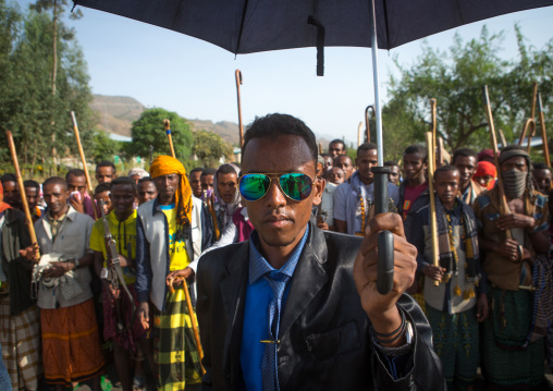Oromo groom with an umbrella during his wedding celebration, Oromo, Sambate, Ethiopia