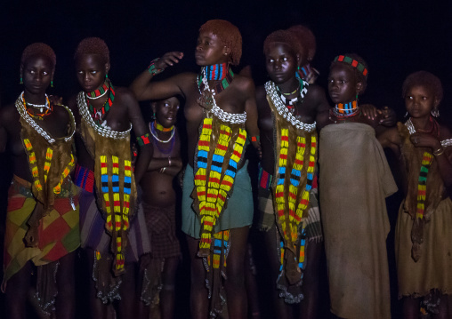 Hamer tribe teenage girls dancing at night, Omo valley, Turmi, Ethiopia