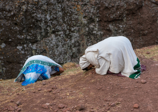 Pilgrim women praying during kidane mehret orthodox celebration, Amhara region, Lalibela, Ethiopia
