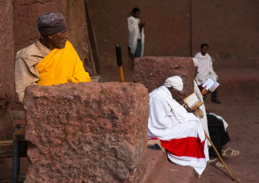 Ethiopian priests in a rock church during kidane mehret orthodox celebration, Amhara region, Lalibela, Ethiopia