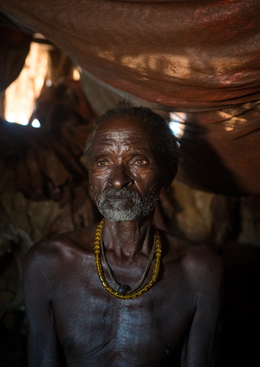 Old hamer tribe man in his hut, Omo valley, Turmi, Ethiopia