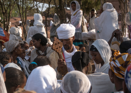 Priest blessing pilgrims during kidane mehret orthodox celebration, Amhara region, Lalibela, Ethiopia