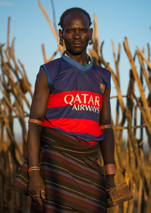 Hamer tribe man with paris saint germain football shirt, Omo valley, Turmi, Ethiopia