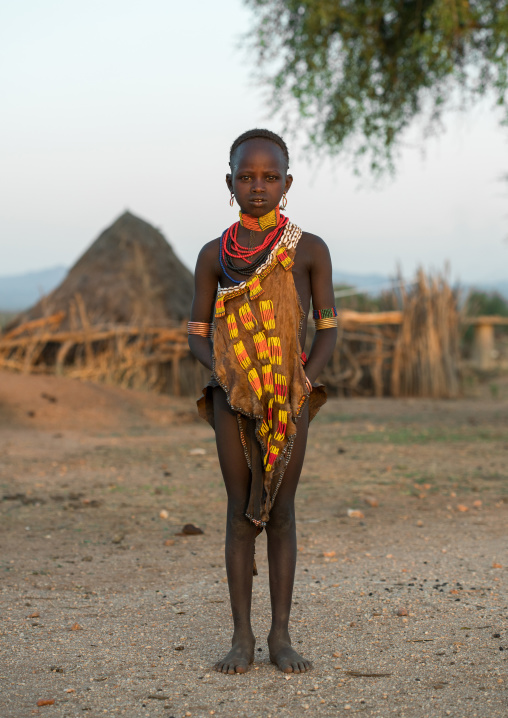Portrait of a hamer tribe girl in traditional clothing, Omo valley, Turmi, Ethiopia