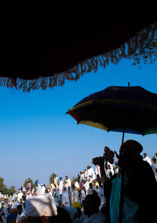 Silhouette of an ethiopian priest blessing the crowd during kidane mehret celebration, Amhara region, Lalibela, Ethiopia