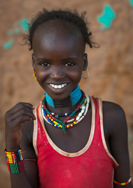 Portrait of a smiling hamer tribe girl, Omo valley, Turmi, Ethiopia