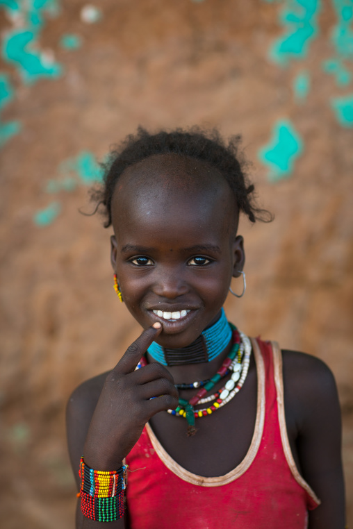 Portrait of a smiling hamer tribe girl, Omo valley, Turmi, Ethiopia